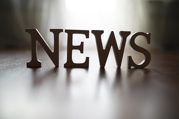 news letters cutout wooden surface with soft light background 494741 143472 2